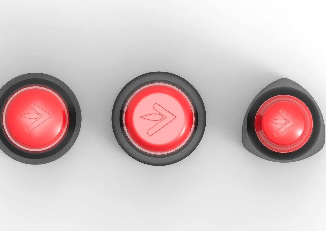 Top view of three black closures with red arrow-marked caps, three closure concepts for the syrup bottle.