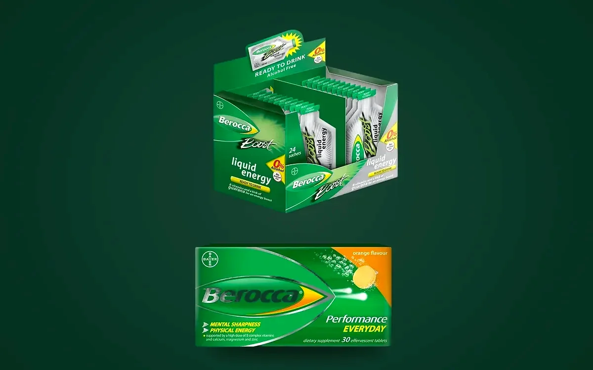 Berocca Boost liquid energy sachet display carton and Berocca Performance effervescent tablet carton designed by Stratcom for Bayer Healthcare, on a deep green field.