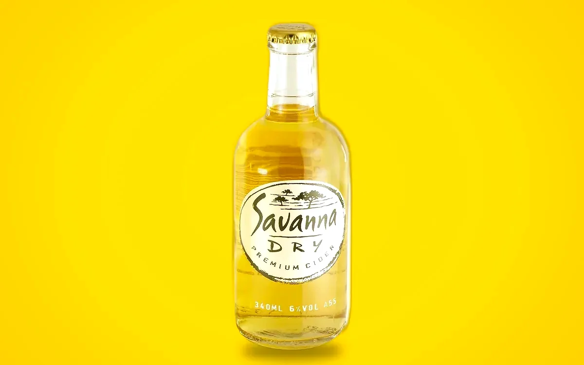 Savanna Dry premium cider 340ml bottle, Stratcom packaging for Distell, on a Savanna yellow field.